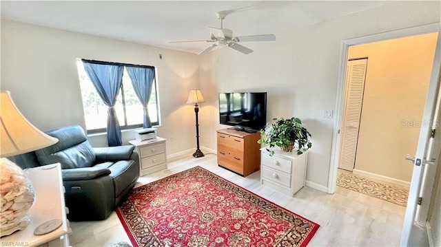 living room featuring ceiling fan