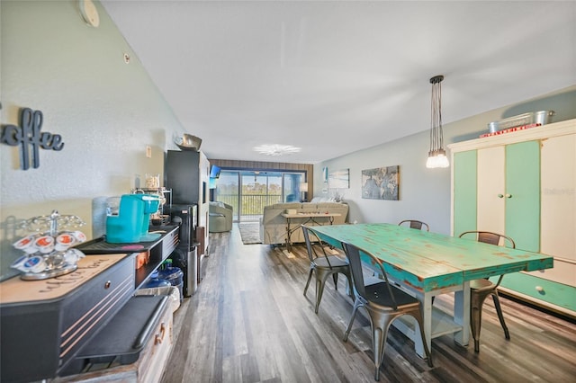 dining space featuring dark hardwood / wood-style floors