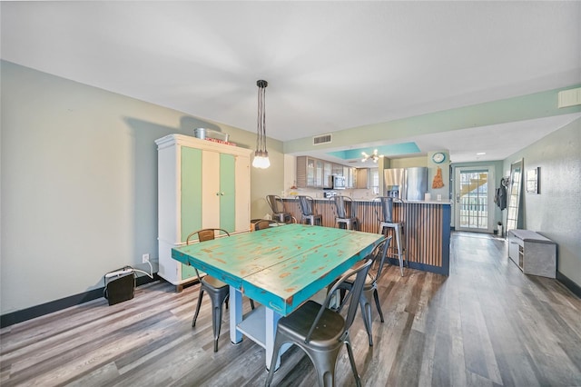 dining area featuring wood-type flooring