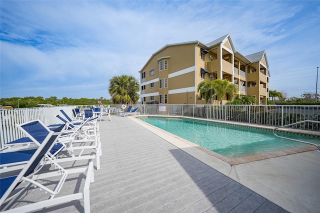 view of swimming pool with a patio area