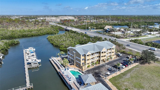 birds eye view of property with a water view