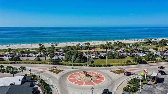 bird's eye view featuring a water view and a view of the beach