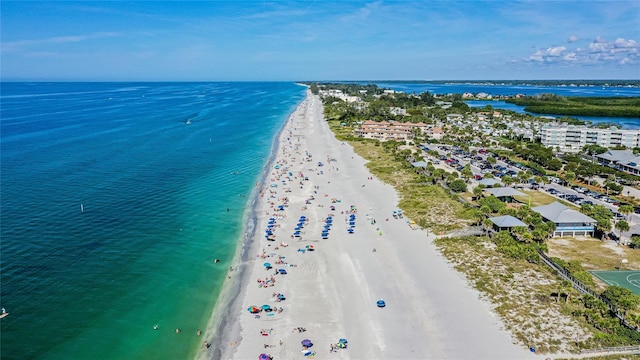 birds eye view of property featuring a view of the beach and a water view