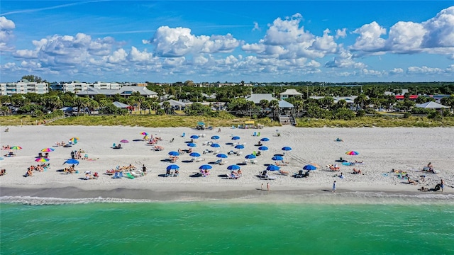 bird's eye view featuring a beach view and a water view