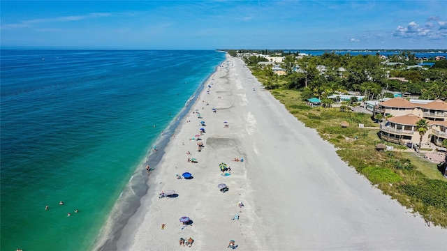 bird's eye view with a view of the beach and a water view