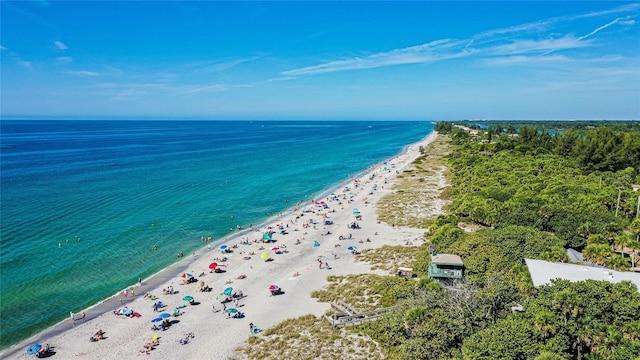 aerial view featuring a view of the beach and a water view