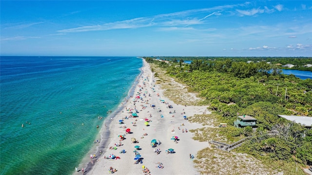 drone / aerial view with a view of the beach and a water view