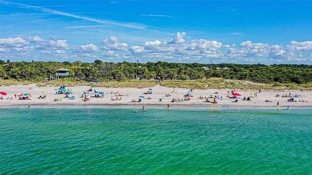 bird's eye view featuring a beach view and a water view