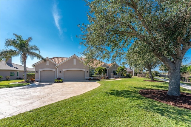 view of front of home featuring a garage and a front yard