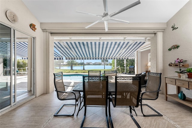 sunroom / solarium with a wealth of natural light and ceiling fan