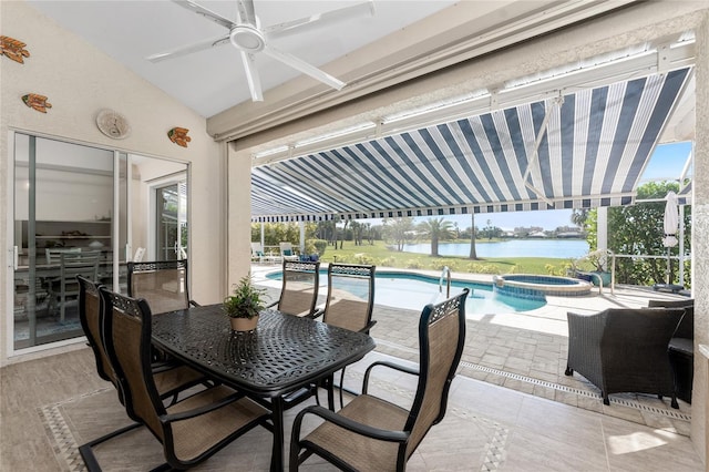 view of patio featuring a water view, ceiling fan, and a swimming pool with hot tub