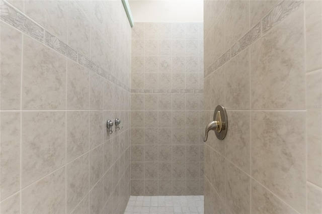 bathroom with tiled shower