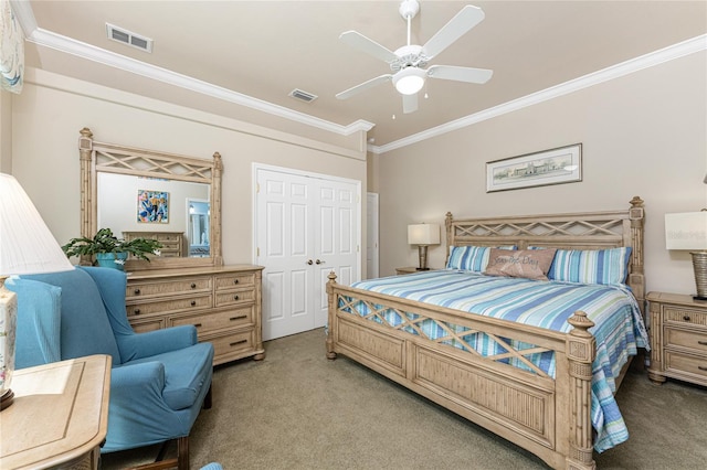 carpeted bedroom with crown molding, ceiling fan, and a closet