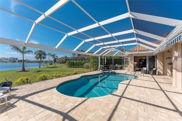 view of swimming pool featuring an in ground hot tub, a patio, glass enclosure, and a water view