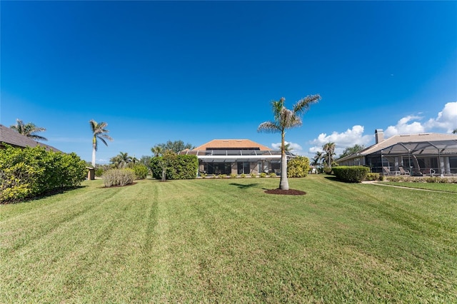 view of yard featuring a lanai