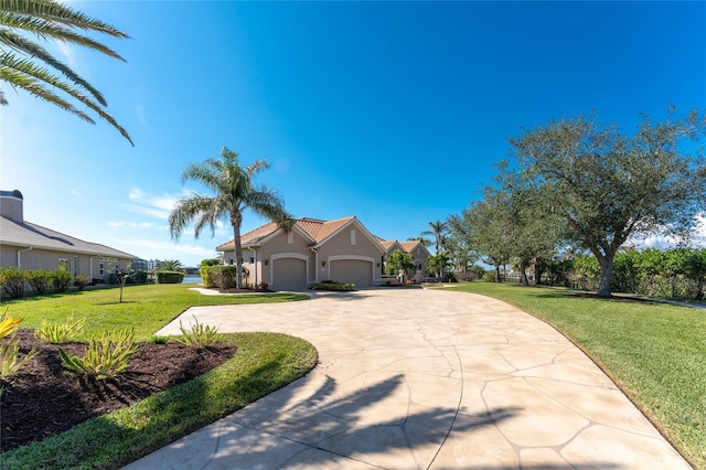 view of front of property with a garage and a front yard