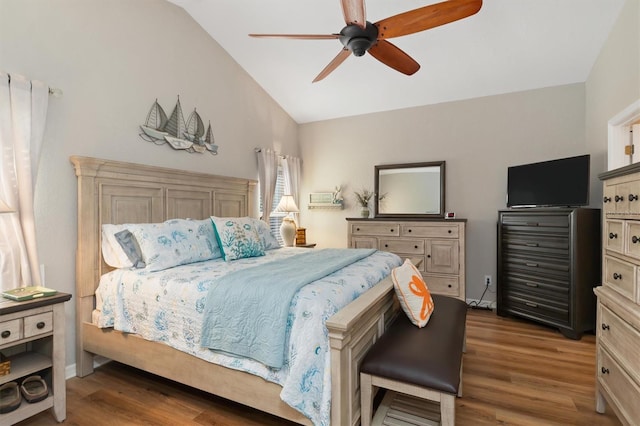 bedroom with lofted ceiling, dark hardwood / wood-style flooring, and ceiling fan