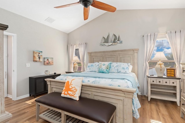 bedroom with lofted ceiling, light hardwood / wood-style floors, and ceiling fan