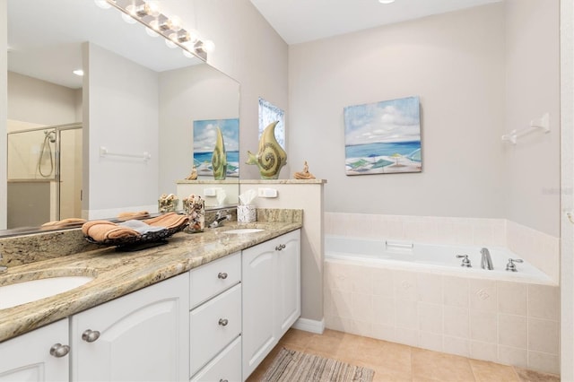 bathroom featuring tile patterned floors, separate shower and tub, and vanity