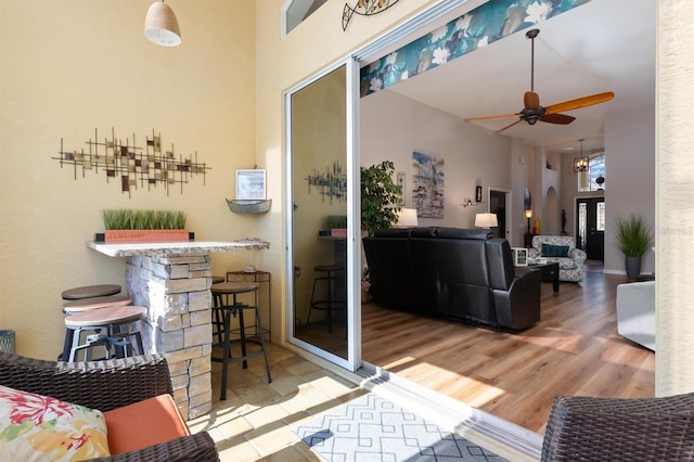 living room featuring hardwood / wood-style floors and ceiling fan