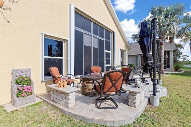 view of patio with an outdoor fire pit