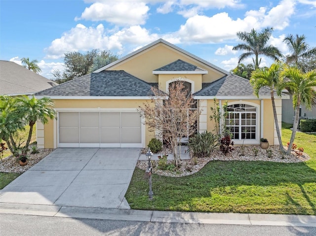 view of front of house featuring a garage and a front yard