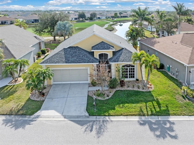 view of front of home featuring a garage and a front yard