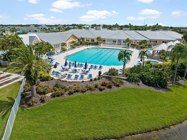 view of pool featuring a yard and a patio area