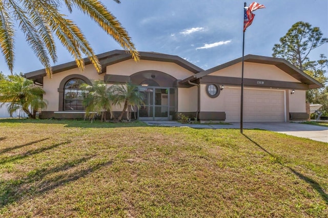 ranch-style house featuring stucco siding, a garage, concrete driveway, and a front yard