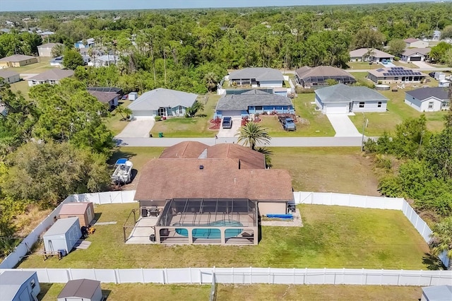 bird's eye view featuring a residential view and a forest view