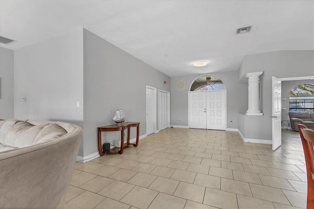 entrance foyer with light tile patterned floors, visible vents, and baseboards