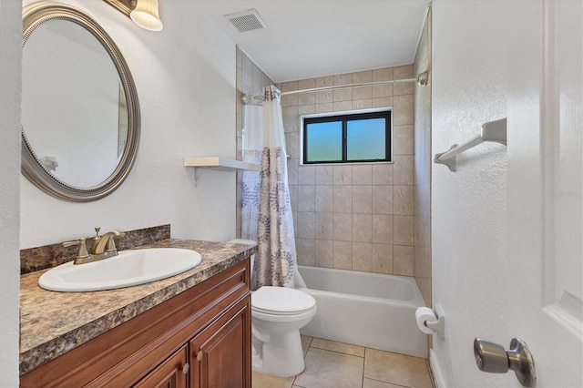 bathroom with visible vents, shower / bath combo with shower curtain, toilet, tile patterned flooring, and vanity