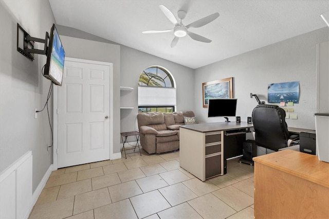 office area with light tile patterned floors, baseboards, and ceiling fan