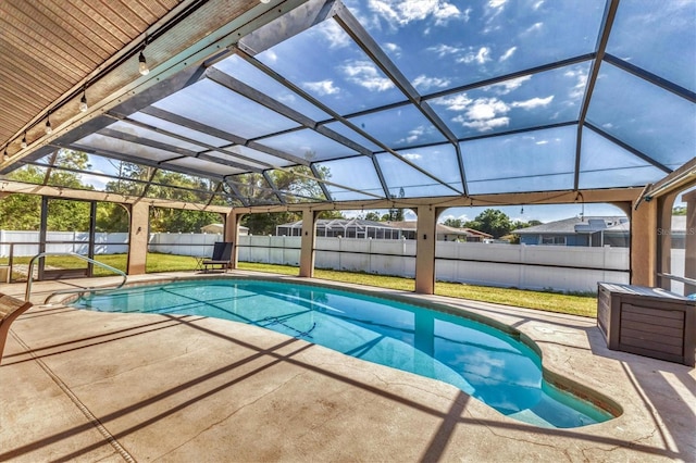 view of pool with a fenced in pool, a patio, a lawn, and a fenced backyard