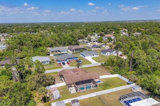 aerial view with a residential view and a view of trees