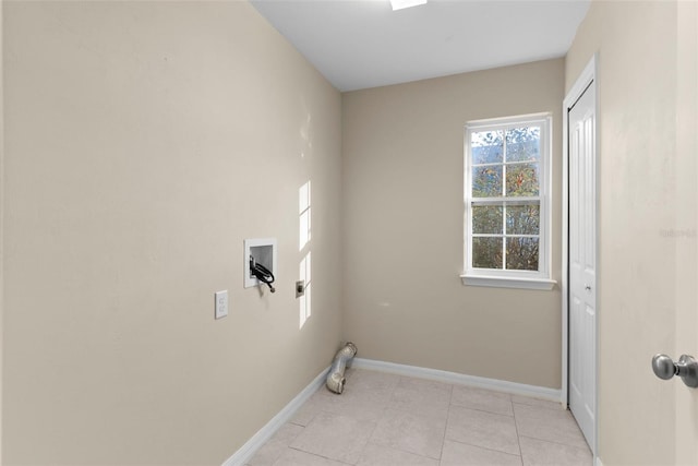 laundry room featuring hookup for a washing machine and light tile patterned floors