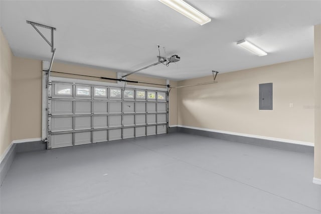 garage with a garage door opener and electric panel