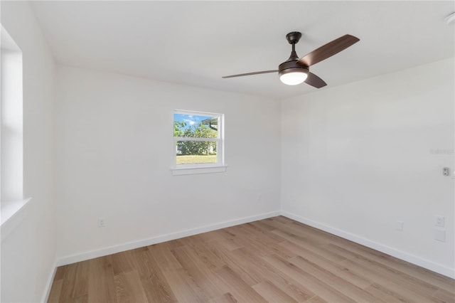 empty room featuring ceiling fan and light hardwood / wood-style flooring