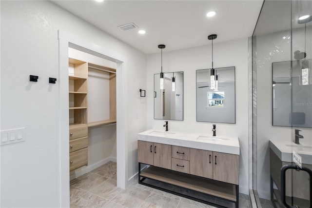 bathroom with vanity and walk in shower