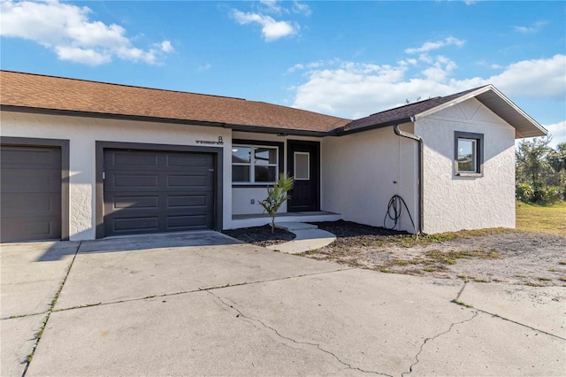 ranch-style house featuring a garage