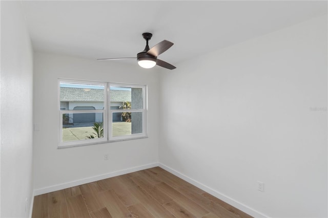 empty room with light hardwood / wood-style flooring and ceiling fan