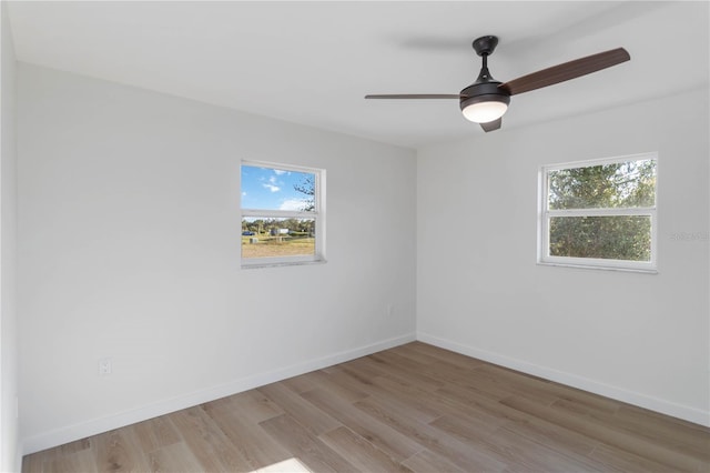 unfurnished room featuring ceiling fan and light wood-type flooring