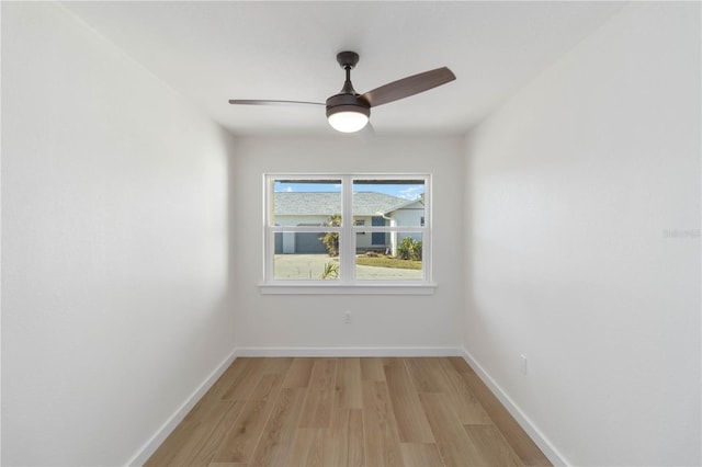 unfurnished room featuring ceiling fan and light wood-type flooring