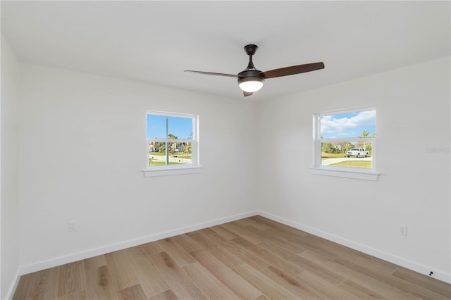 spare room with ceiling fan and light hardwood / wood-style floors