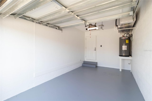 garage featuring a garage door opener and electric water heater