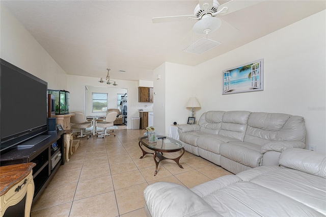 living room with light tile patterned floors and ceiling fan