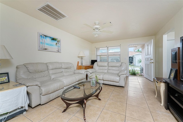 tiled living room with ceiling fan