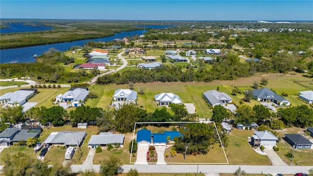 birds eye view of property featuring a residential view and a water view