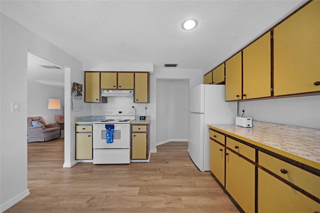 kitchen featuring a textured ceiling, white appliances, and light hardwood / wood-style flooring