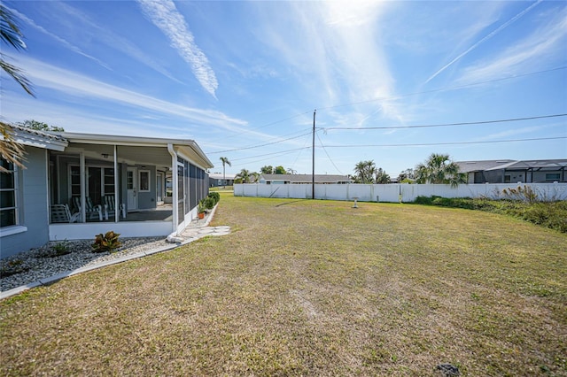 view of yard with a sunroom